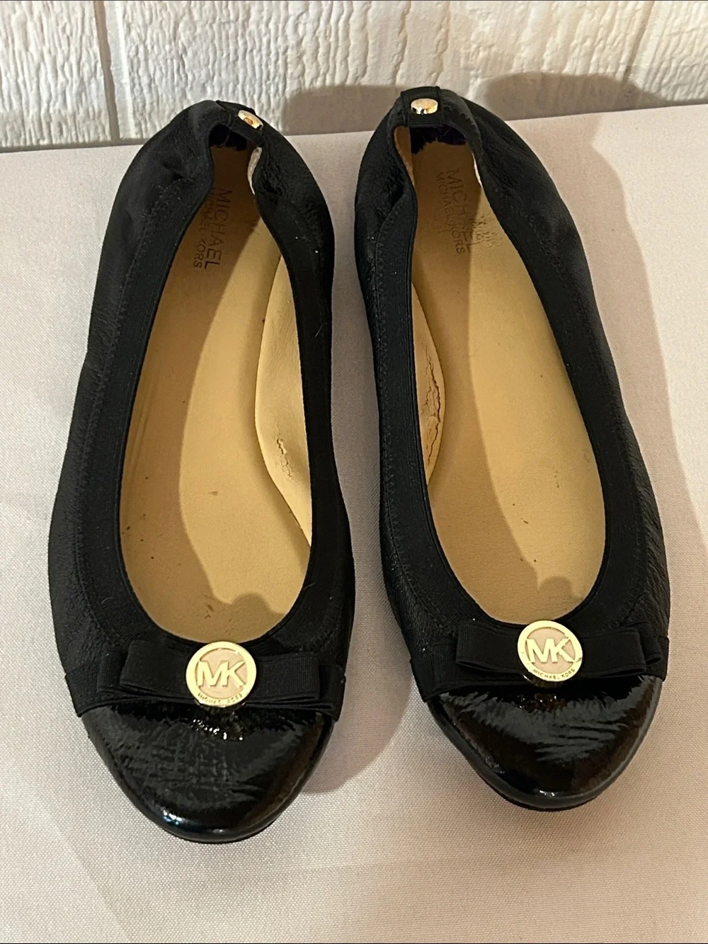 Michael Kors Black Ballet Flats with Gold MK Emblem